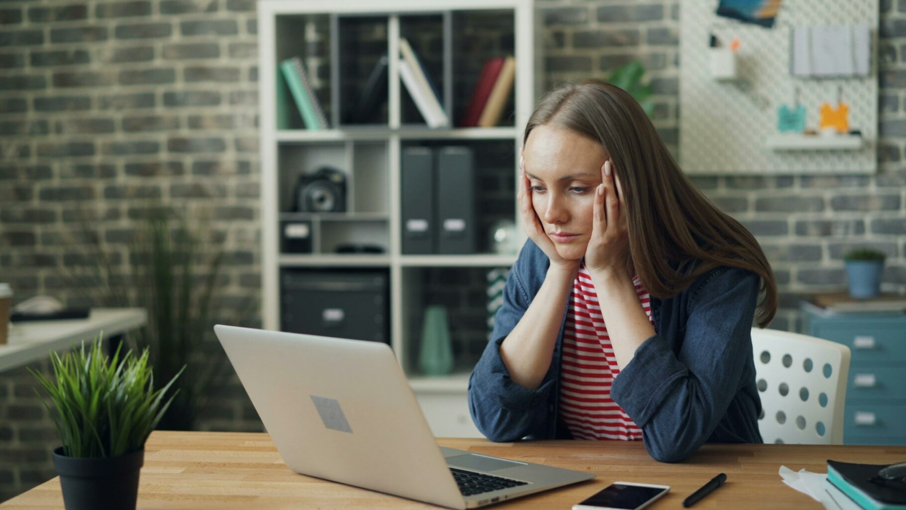 Woman feeling frustrated while working